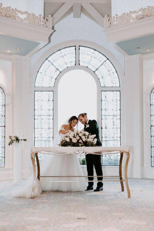 bride and groom, couple, wedding ceremony, ceremony, unity ceremony, unity candle, candle lighting, Disney's wedding pavilion, wedding pavilion