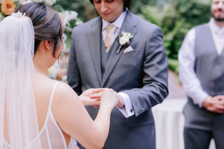 bride and groom, couple, wedding ceremony, ceremony, bride and groom at wedding ceremony, couple at wedding ceremony, rings, exchanging rings, couple exchanging rings, brisa courtyard, grand californian