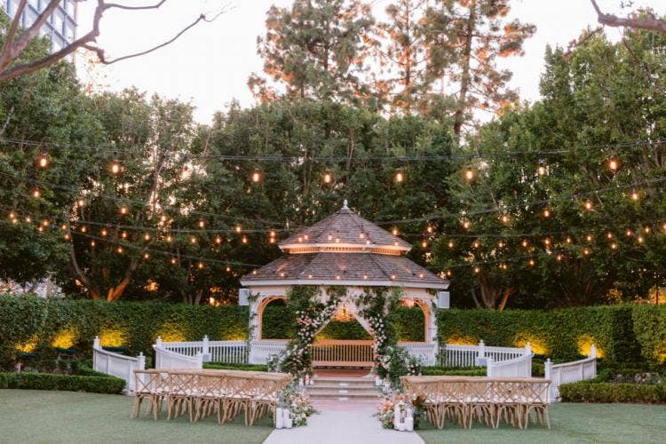 decorated wedding ceremony, ceremony, wedding ceremon, rose court, rose court garden, altar area, floral, aisle floral, custom aisle floral, altar floral, custom altar floral, string lights, aisle candles, custom chairs
