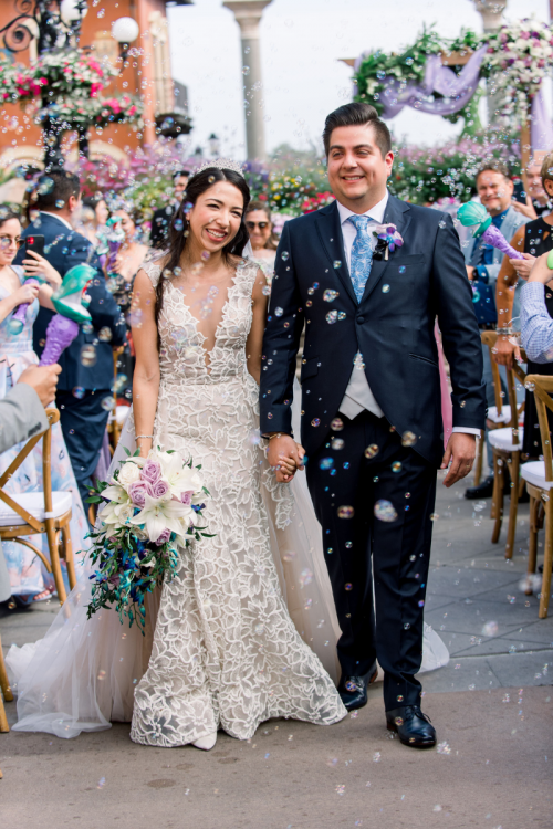 bride and groom, exit, staged exit, bubbles, bubble wand, bubble exit, bubble wand exit, wedding ceremony, ceremony, epcot, italy, italy plaza, italy pavilion, candid