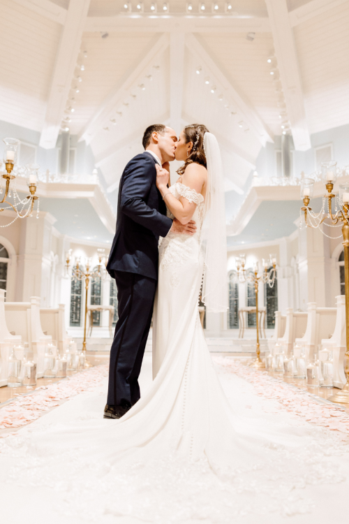 bride and groom, couple, portrait, couple portrait, disney's wedding pavilion, wedding pavilion, pavilion, kiss, wedding ceremony, ceremony