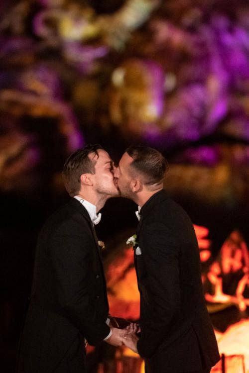groom groom, lgbtq, lgbtq couple, wedding ceremony, ceremony, disney's animal kingdom, animal kingdom, tree of life, tree of life ceremony, first kiss, kiss