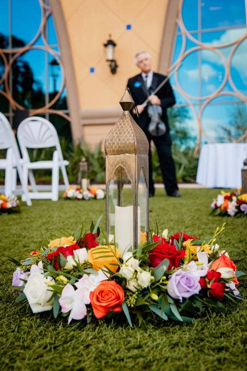 wedding ceremony, ceremony, aisle, aisle decor, aisle floral, candles, aisle candles, red floral, yellow floral, coronado, coronado springs, Destino plaza