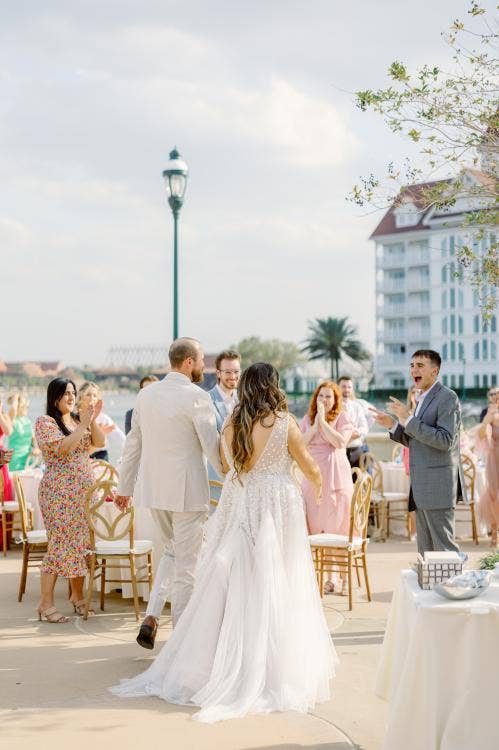 bride and groom, couple, couple with guests, wedding reception, reception, summerhouse patio, grand floridian