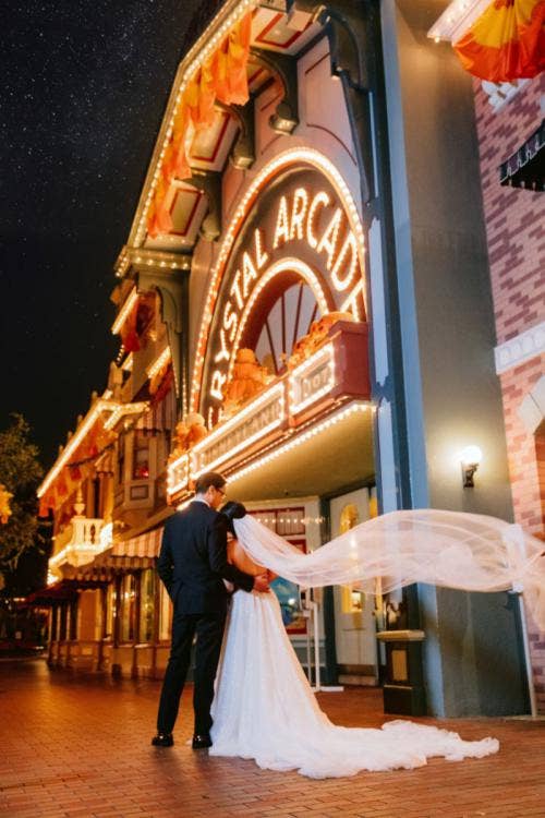 bride and groom, couple, portrait, couple portrait, disneyland, crystal arcade, halloween, halloween time, halloween theme, halloween decor, fall