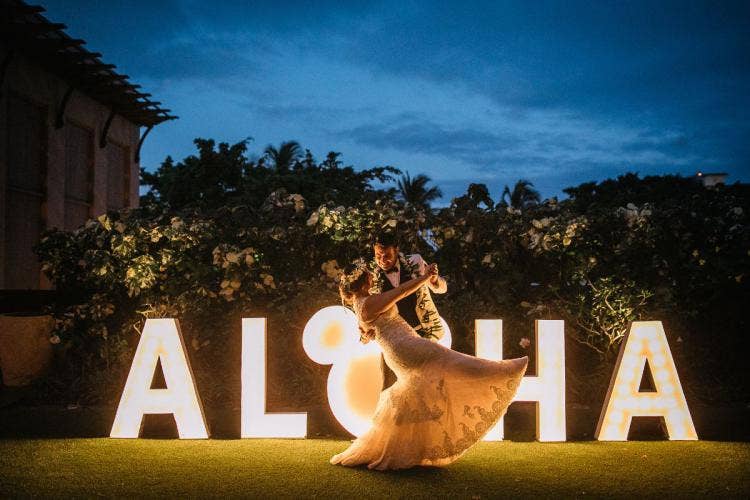 bride and groom, couple, wedding reception, reception, reception decor, light up sign, letter sign, lighted letters, aloha, aloha sign, hidden mickey, aulani