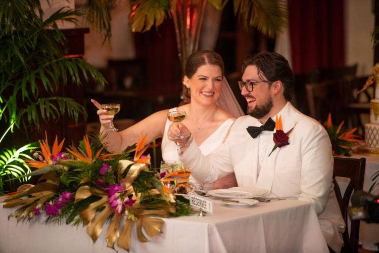 bride and groom, couple, wedding reception, reception, candid, sweetheart table, cheers, hollywood studios, brown derby, brown derby reception