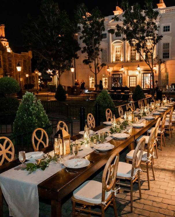 wedding reception, reception, decorated reception, long table, custom chairs, table runner, custom centerpieces, reception decor, lanterns, table decor, Epcot, Epcot reception, uk, uk pavilion, uk courtyard