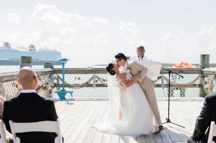 couple, first kiss, kiss, ceremony, wedding ceremony, castaway cay, the wedding pointe, Disney Cruise Line, cruise wedding
