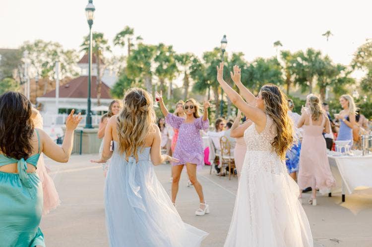 bride, dancing, guests, bride with guests, wedding reception, reception, summerhouse patio, grand floridian