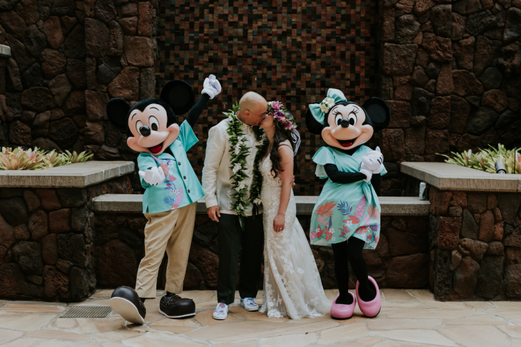bride and groom, mickey and minnie, couple portraits, lei, flower crown, aulani, aulani wedding, traditional lei, hawaii, kipuka, kipuka courtyard