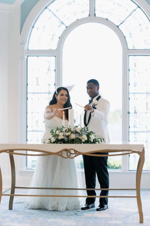bride and groom, couple, wedding ceremony, ceremony, unity candle, unity ceremony, Disney's wedding pavilion, wedding pavilion