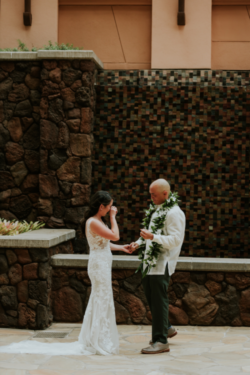 bride and groom, first look, bride and groom portraits, aulani, alauni resort, kipuka courtyard, kipuka, lei, traditional lei, hawaii, hawaiian wedding, aulani wedding