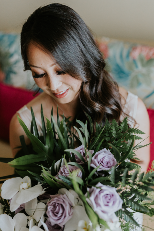 bride, bridal portrait, wedding dress, bridal bouquet, palm fronds, tropical floral, tropical bouquet, getting ready, bride getting ready, hawaii, aulani, aulani wedding, aulani resort, hawaiian wedding