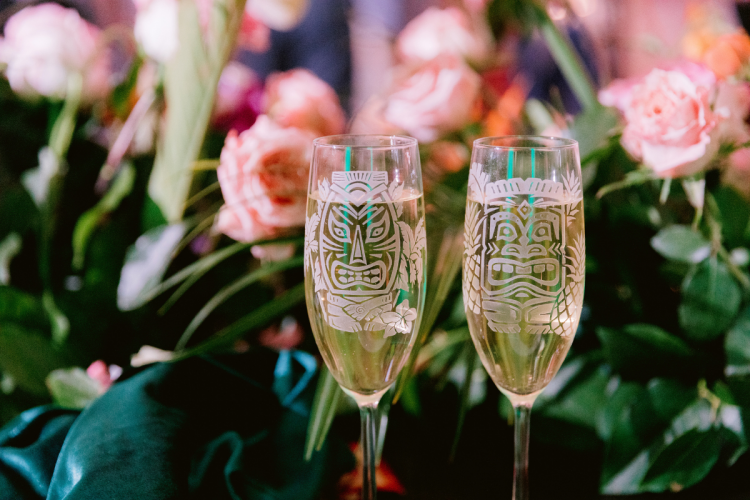 wedding reception, wedding reception decor, wedding reception toast, reception toasting glasses, tropical, tropical theme, tropical decor, tropical flowers, champagne