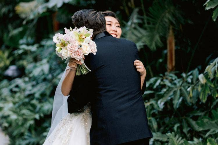 bride and groom, couple, first look, Disneyland, Disneyland Hotel, hugging