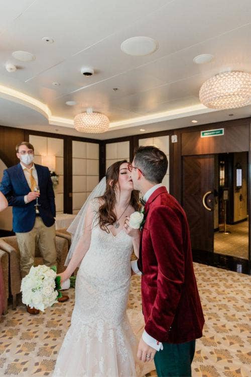 bride and groom, couple, entrance, wedding reception, reception, disney cruise line, cruise line, cruise, disney cruise, cruise wedding, cake and champagne, celebration, wedding celebration, disney dream, kiss