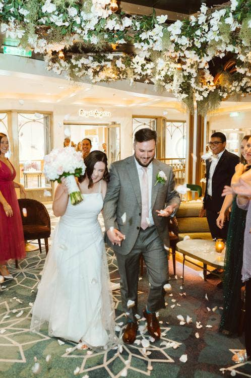 bride and groom, couple, exit, staged exit, wedding ceremony, ceremony, Disney Wish, Disney cruise line, cruise wedding, the bayou