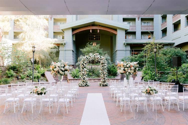 decorated wedding ceremony, wedding ceremony, ceremony, altar floral, floral arch, altar arch, boho floral, fall floral, fall, boho, aisle runner, brisa courtyard