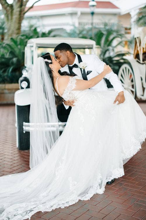 bride and groom, couple, portrait, kiss, couple portrait, kiss, grand Floridian, Disney's grand Floridian resort & spa