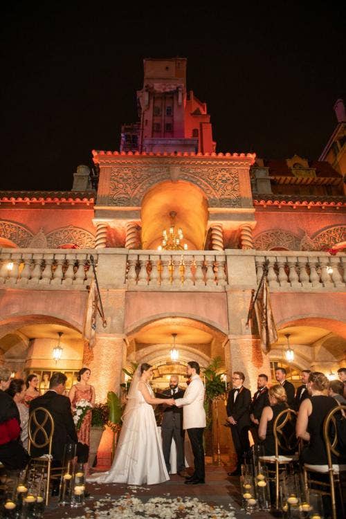 bride and groom, couple, wedding ceremony, ceremony, candid, vows, sharing vows, custom up lighting, up lighting, nighttime, tower of terror, hollywood studios
