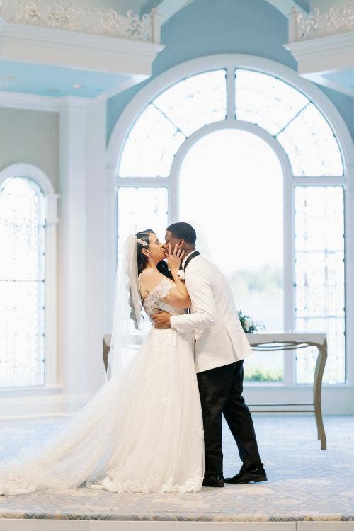 bride and groom, couple, first kiss, kiss, wedding ceremony, ceremony, Disney's wedding pavilion, wedding pavilion