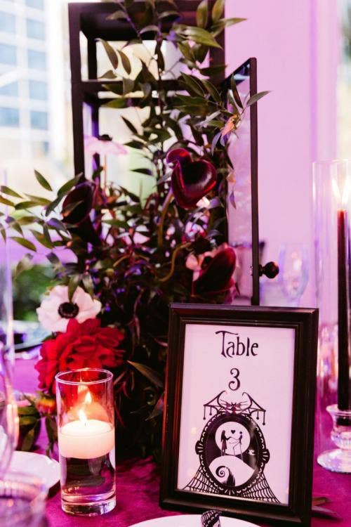 wedding reception, reception, reception decor, decor, reception floral, table decor, table floral, centerpieces, nightmare before christmas, halloween, halloween theme, moody aesthetic, moody decor, moody floral