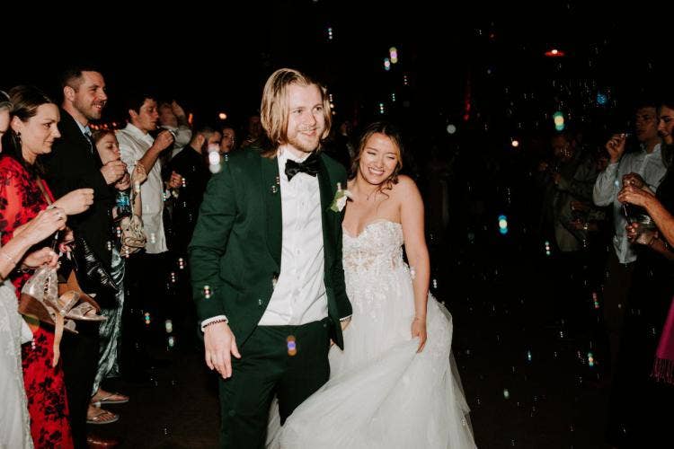 bride and groom, couple, staged entrance, reception entrance, wedding reception, reception, bubbles, bubble entrance, Disney's animal kingdom, animal kingdom