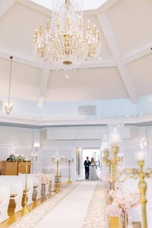 bride, entrance, bride entrance, wedding ceremony, ceremony, Disney's wedding pavilion, wedding pavilion, aisle floral, aisle decor, pink floral, cherry blossoms, gold candelabras, petal toss, pink petal toss