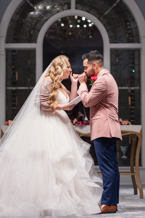 bride and groom, couple, wedding ceremony, ceremony, candid, kiss, vows, sharing vows, wedding pavilion, disney's wedding pavilion, grand floridian, grand floridian resort, disney's grand floridian resort & spa