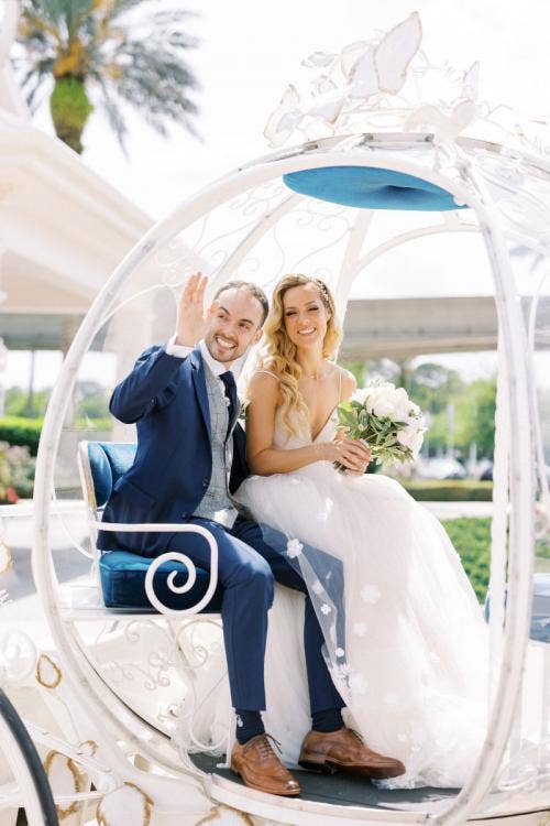 bride and groom, couple, exit, wedding ceremony, ceremony, Cinderella's Coach, coach, Disney's wedding pavilion, wedding pavilion