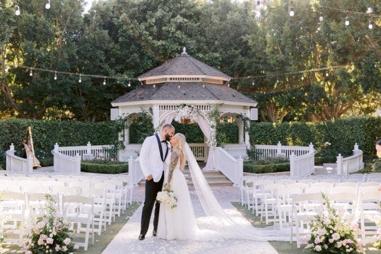 bride and groom, couple, portrait, wedding ceremony, ceremony, rose court, rose court garden, Disneyland, Disneyland Hotel