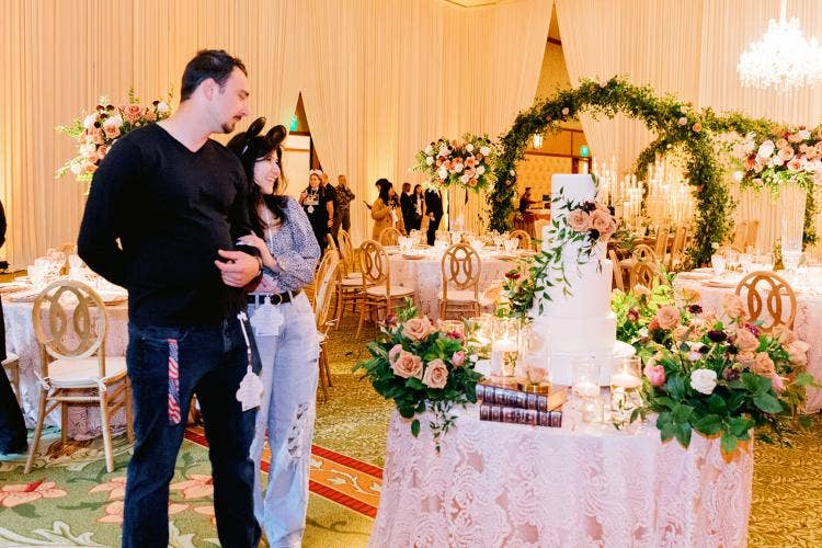 Disney Weddings showcase, Disneyland showcase, showcase, showcase 2023, Disneyland showcase 2023, grand californian, grand californian ballroom, wedding cake, cake, drape, wall drape, boho, boho decor, boho floral