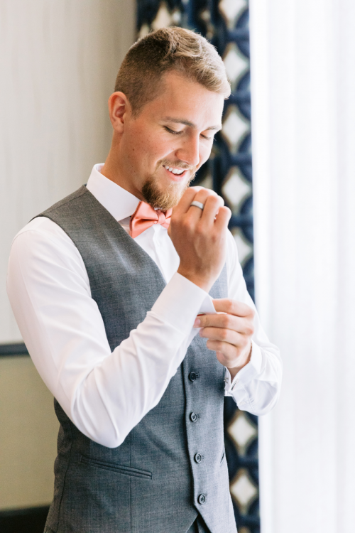 groom, getting ready, portrait, groom portrait, candid, disneyland, disneyland hotel, rose court, rose court garden, wedding day, wedding, wedding ceremony