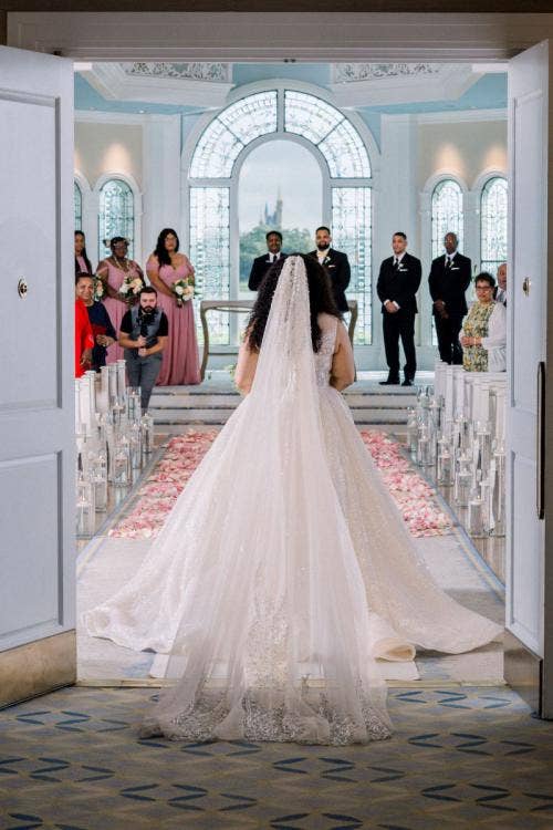 bride, candid, wedding ceremony, ceremony, disney's wedding pavilion, wedding pavilion, pink floral, entrance, bride entrance, ceremony entrance