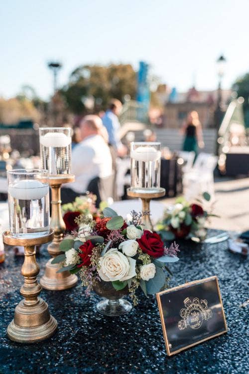 wedding reception, reception, decor, table decor, centerpiece, table centerpiece, holiday, holiday decor, holiday floral, reception floral, candles, floating candles, Epcot, Italy pavilion, Italy Isola
