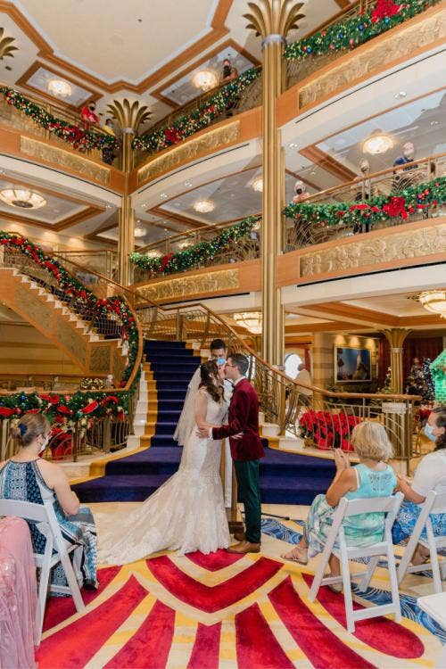 bride and groom, couple, wedding ceremony, ceremony, disney cruise line, cruise line, cruise, disney cruise, cruise wedding, atrium, christmas, christmas wedding, christmas cruise, first kiss, kiss