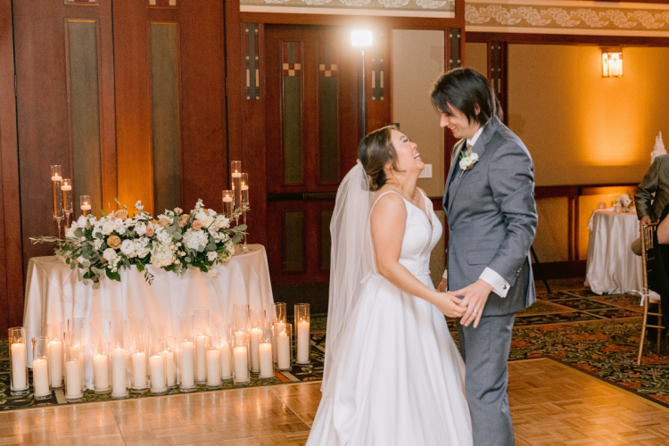 bride and groom, couple, first dance, wedding reception, reception, reception decor, sweetheart table, floating candles, candid, dance, dance floor, grand californian ballrooms