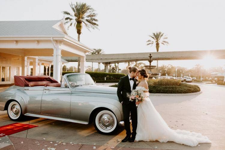 bride and groom, couple, portrait, transportation, vintage car, car, motorcar, boho floral, floral