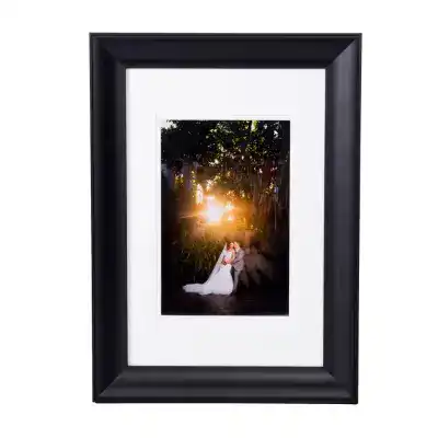 A wedding couple’s framed metallic paper print, one of the Wall Art products offered by Disney Fine Art Photography