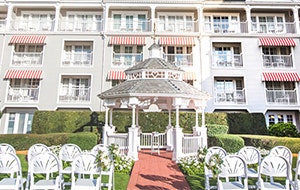 Two sections of a chairs face a gazebo in a hotel courtyard