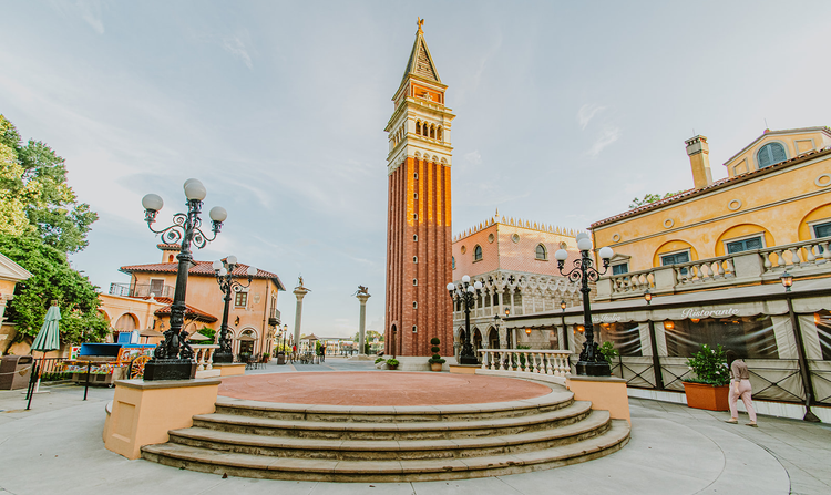 A terrace at the center of the Italy Pavilion in EPCOT featuring a tall bell tower