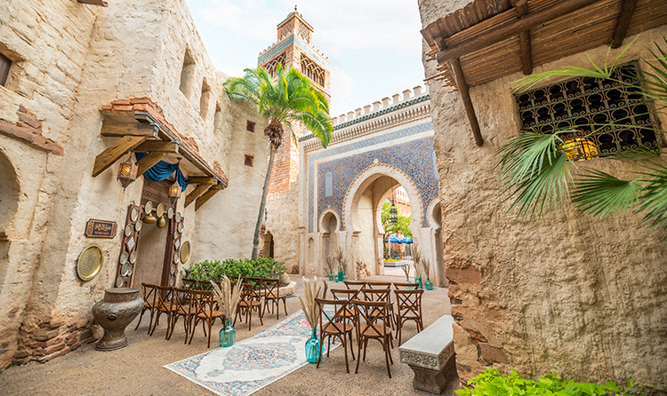 3 small rows of chairs surrounding a wedding aisle outside of a storefront in the Morocco Pavilion at EPCOT