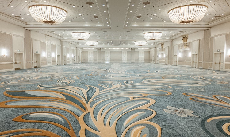 A large ballroom with ornate chandeliers at Disney's Grand Floridian Convention Center