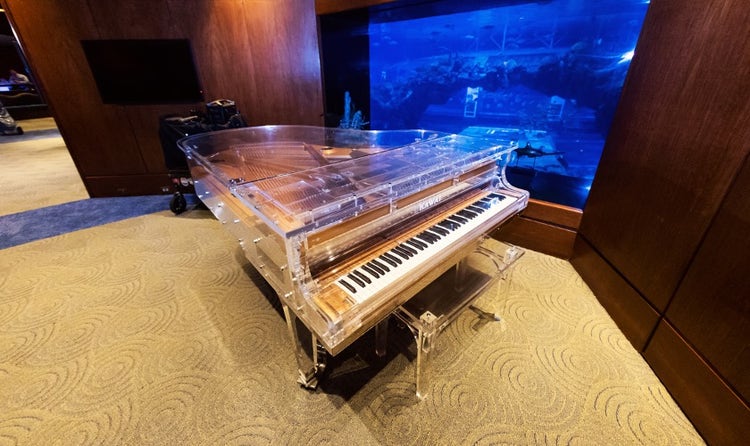 A grand piano in the Living Seas Salon in World Nature at EPCOT
