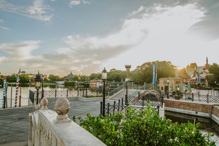 Several EPCOT pavilions are visible from the landing at Italy Isola