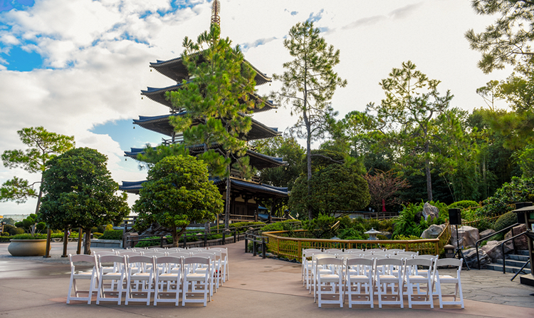 30 chairs arranged in 3 rows for an outdoor wedding beside a pagoda in the Japan Pavilion at EPCOT