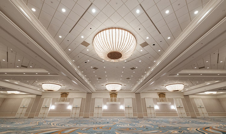 A large ballroom with ornate chandeliers at Disney's Grand Floridian Convention Center