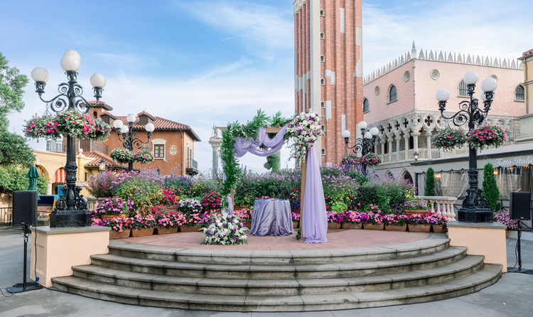 A terrace at the center of the Italy Pavilion in EPCOT featuring a wedding alter and flowers