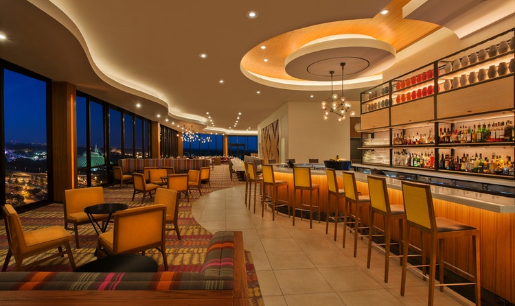 The lounge at California Grill in Disney’s Contemporary Resort with views of Magic Kingdom park